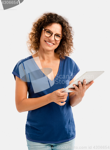 Image of Happy woman working with a tablet