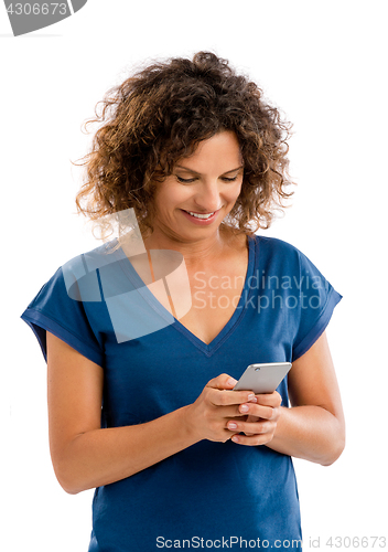 Image of Happy woman texting