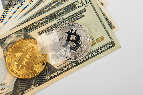 Image of Bitcoin coin with dollars