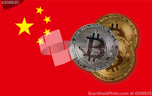 Image of Bitcoin coins on red China flag