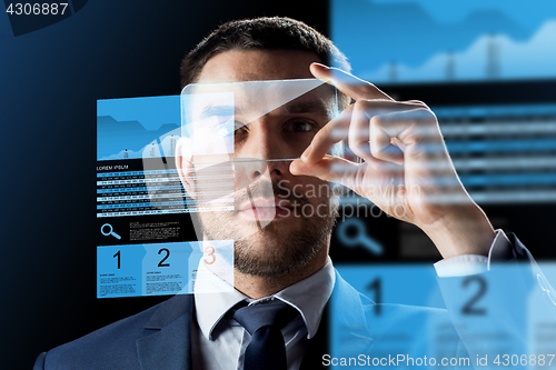 Image of businessman with smartphone and exchange charts