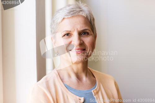 Image of portrait of happy smiling gray senior woman