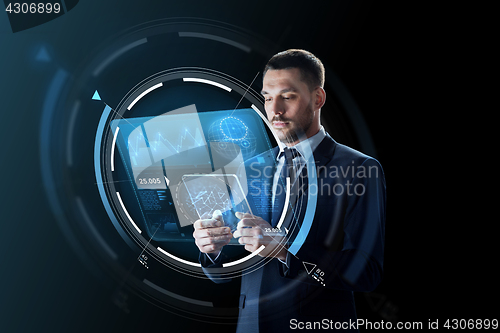 Image of businessman with tablet pc and virtual projection