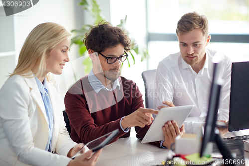 Image of business team with tablet pc at office