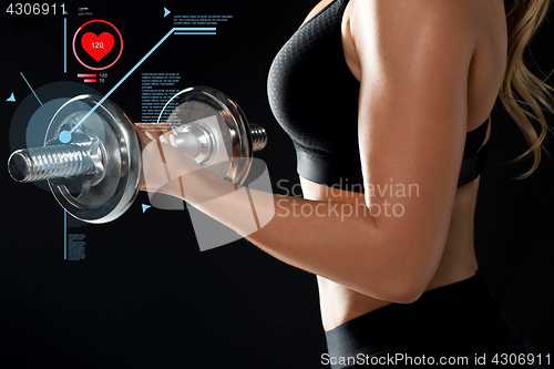Image of close up of woman with dumbbell and pulse