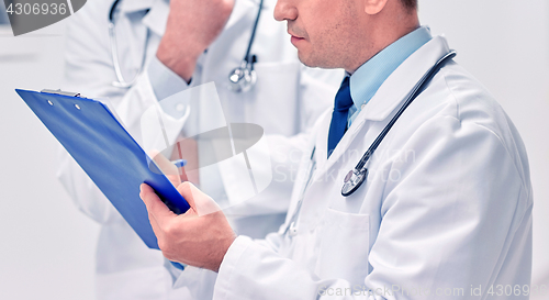 Image of close up of doctors with clipboard at hospital