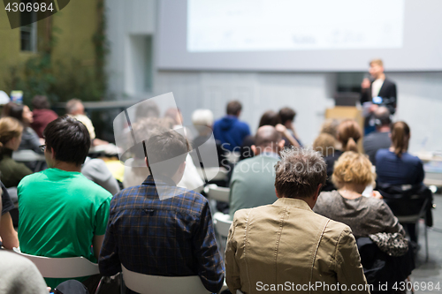 Image of Man giving presentation in lecture hall at university.