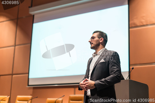 Image of Speaker giving talk at Business Conference.