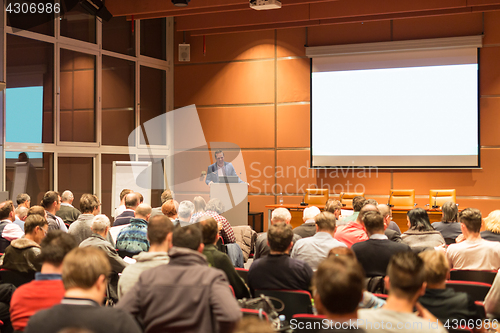 Image of Business speaker giving a talk at business conference event.