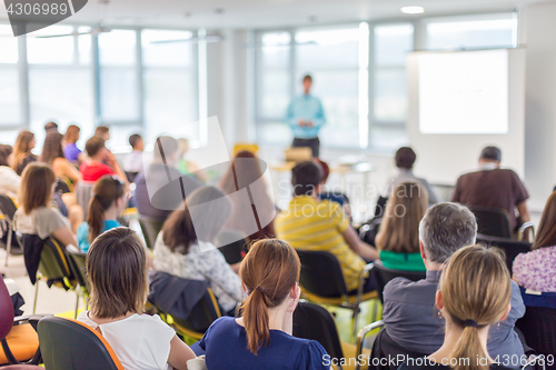 Image of Speaker giving presentation on business conference.