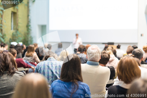 Image of Woman giving presentation on business conference.