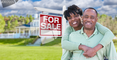 Image of Happy African American Couple In Front of Beautiful House and Fo