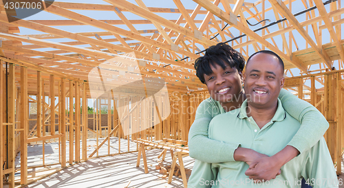 Image of Happy African American Couple Inside Construction Framing of New