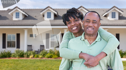 Image of Happy African American Couple In Front of Beautiful House.