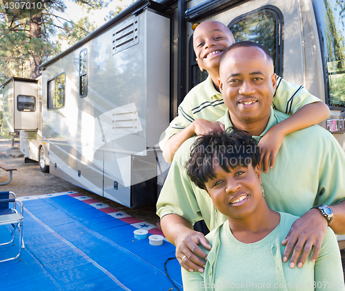 Image of Happy African American Family In Front of Their Beautiful RV At 