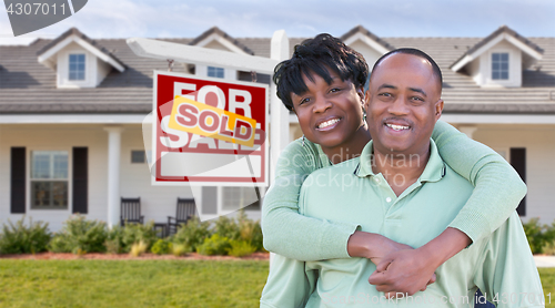 Image of Happy African American Couple In Front of Beautiful House and So