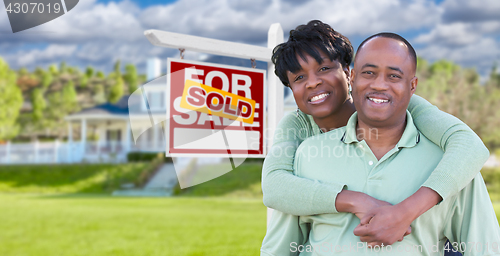 Image of Happy African American Couple In Front of Beautiful House and So