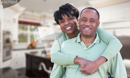Image of Happy African American Couple Inside Beautiful Custom Kitchen.