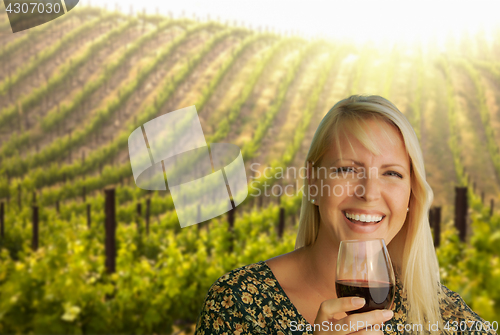Image of Attractive Young Woman With Wine Glass in A Vineyard.