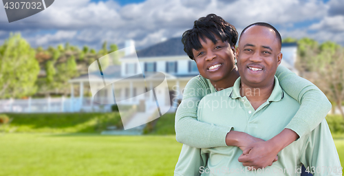 Image of Happy African American Couple In Front of Beautiful House.