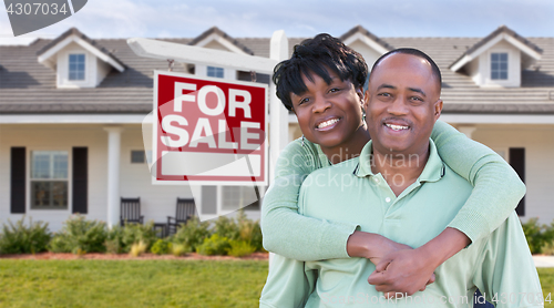 Image of Happy African American Couple In Front of Beautiful House and Fo