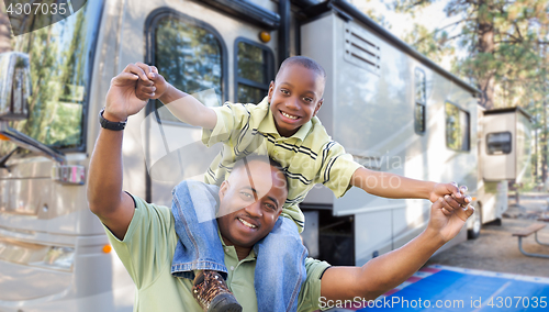 Image of Happy African American Father and Son In Front of Their Beautifu