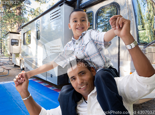 Image of Happy Hispanic Father and Son In Front of Their Beautiful RV At 