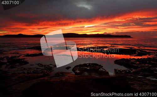 Image of Vivid red dawn scene Pearl Beach Australia