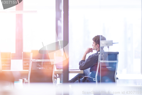 Image of Businessman at the work in his bright office