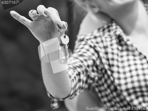 Image of Closeup of woman holding house keys