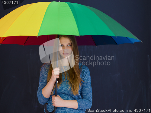 Image of handsome woman with a colorful umbrella