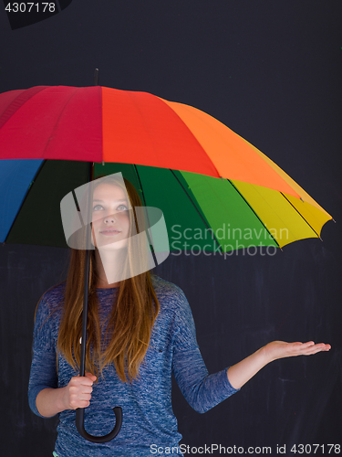 Image of handsome woman with a colorful umbrella