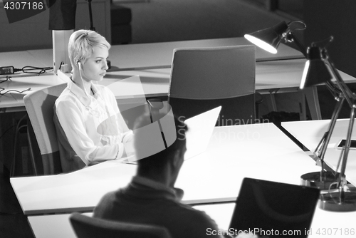 Image of Businesswoman using laptop at work