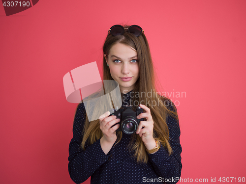 Image of girl taking photo on a retro camera