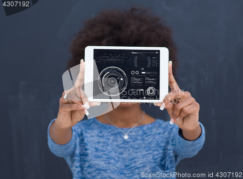 Image of Happy African American Woman Using Digital Tablet