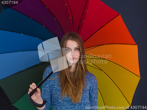 Image of handsome woman with a colorful umbrella