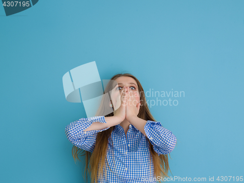 Image of young woman playing with her long silky hair