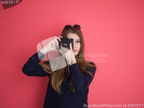 Image of girl taking photo on a retro camera