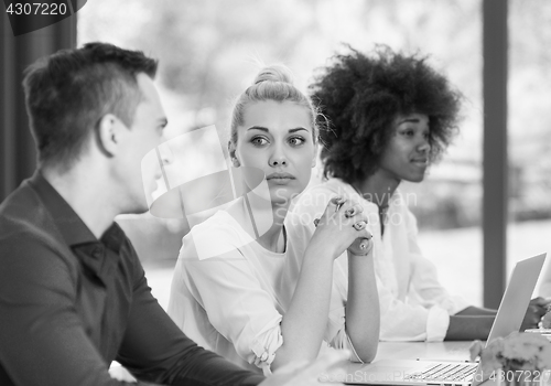 Image of Young businesswoman at work