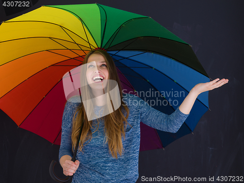 Image of handsome woman with a colorful umbrella