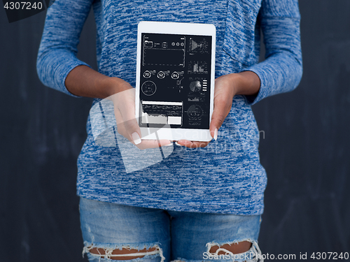 Image of Happy African American Woman Using Digital Tablet