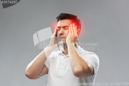 Image of unhappy man suffering from head ache