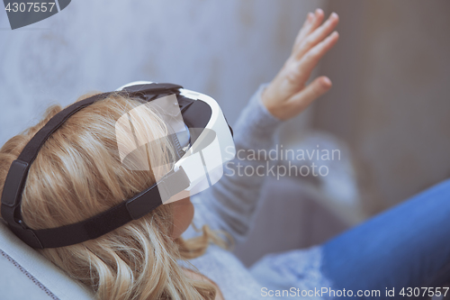 Image of Woman wearing Virtual reality headset