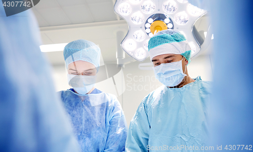 Image of group of surgeons in operating room at hospital