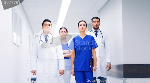 Image of group of medics or doctors at hospital corridor