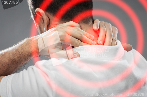 Image of close up of man suffering from neck pain