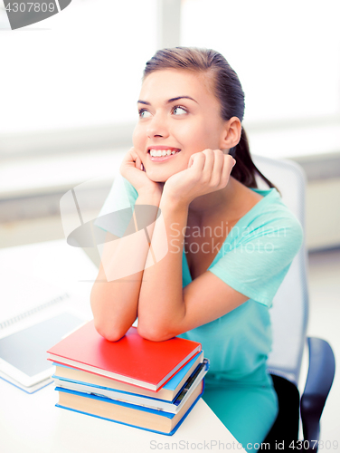 Image of happy smiling student girl with books