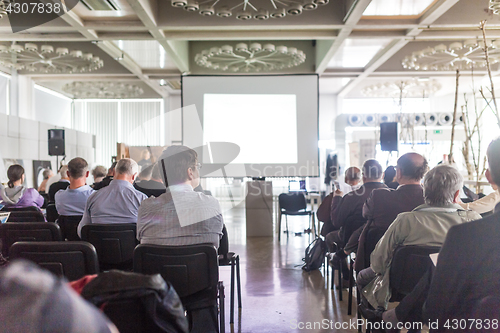 Image of Business speaker giving a talk at business conference event.