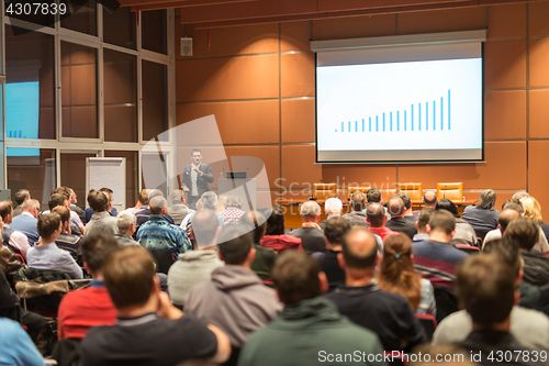 Image of Business speaker giving a talk at business conference event.