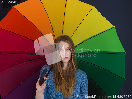 Image of handsome woman with a colorful umbrella